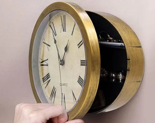 Hidden-Safe Storage Clock — hand opening the clock face to reveal the concealed compartment on the wall