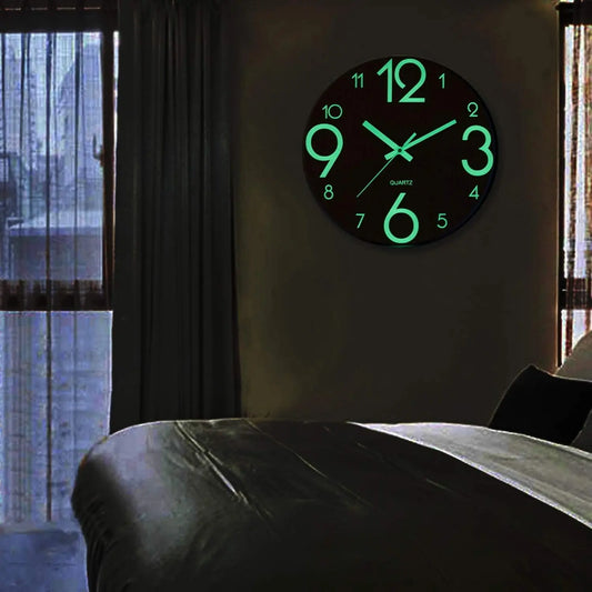 Nordic Glow Wall Clock glowing softly on a bedroom wall at night
