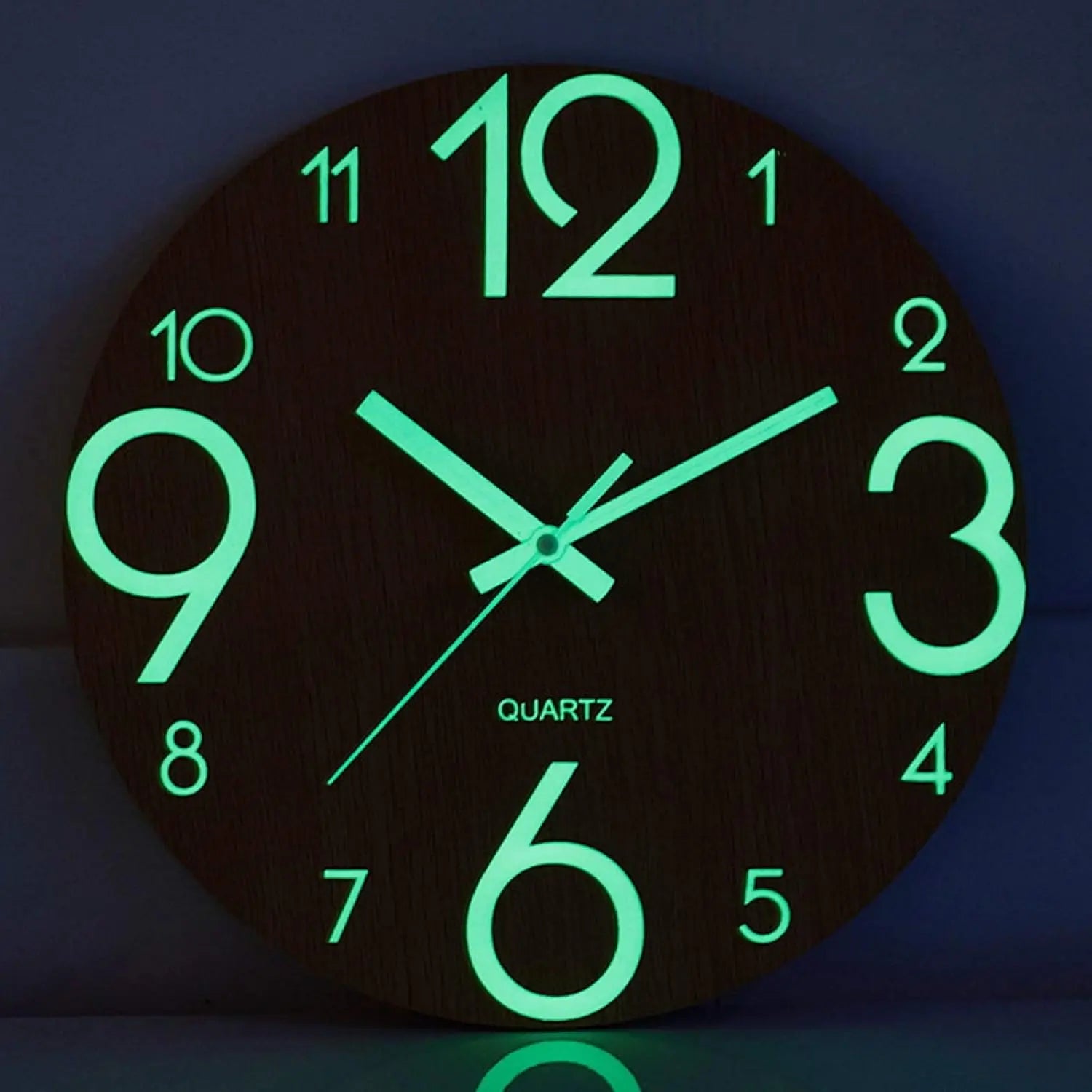 Nordic Glow Wall Clock face glowing green in the dark, close-up detail