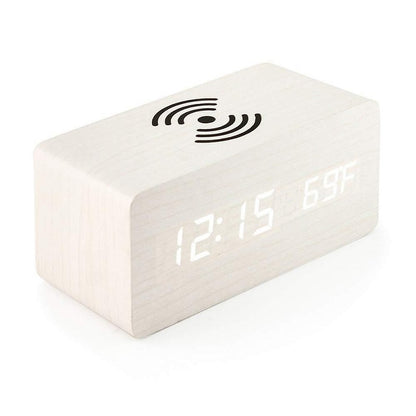 Timber Charge Wireless Alarm Clock, phone wirelessly charging on the pad