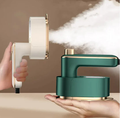Travel Garment Steamer in Beige and Green, steaming a garment in use
