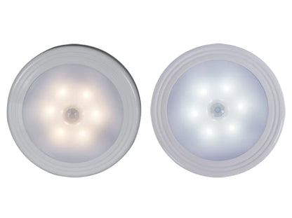 Motion-sensor closet light in use inside a wardrobe