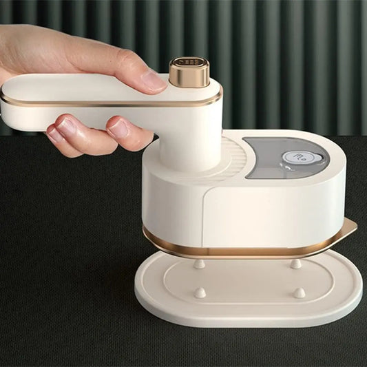 Hand holding and operating the folding garment steamer