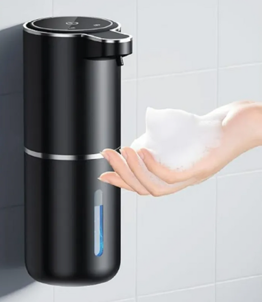 TouchFree Auto Soap Dispenser on a bathroom sink, hand waving underneath to dispense foam