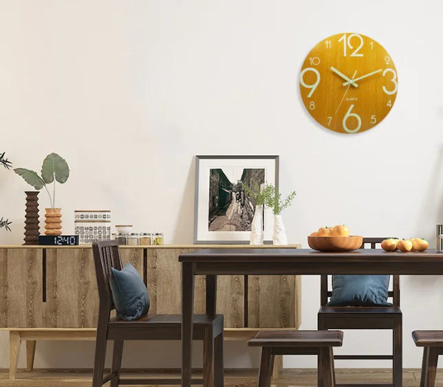 Nordic Glow Wall Clock in Yellow, mounted above a dining sideboard